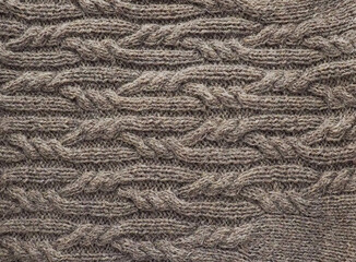 texture of woolen fabric knitted with knitting needles