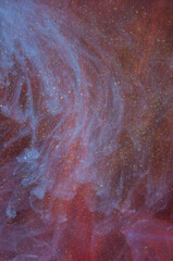 Fluid swirling sparkly ink drops in water backgrounds textures Red Blue Purple Pink Gold