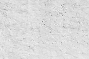 old plaster wall painted in white gives a harmonic background