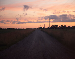 Country gravel road during sunset
