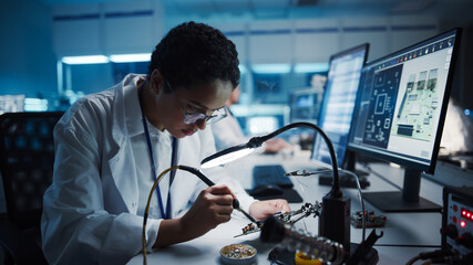 Modern Electronics Research, Development Facility: Black Female Engineer Does Computer Motherboard...