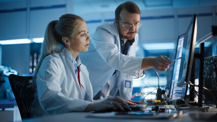 Electronics Research, Development Facility: Engineer Project Manager Talks With Scientist working...