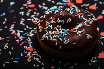 chocolate donuts with sugar sprinkles