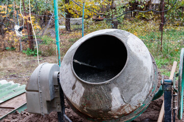 Mixing of concrete in the concrete mixer at construction site