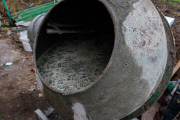Mixing of concrete in the concrete mixer at construction site