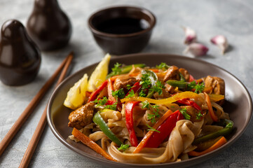 Rice noodles with chicken, soy and vegetables, asian cuisine.