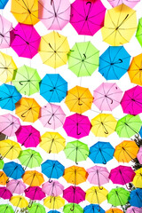 Fototapeta na wymiar Vertical Overhead Collection of Colored Umbrellas