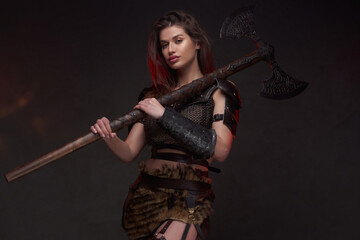 Nordic female fighter with long brown hairs and axe