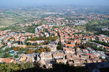 Fototapeta na wymiar A panoramic top view of the suburban areas of San Marino. Horizontal shot, panorama.