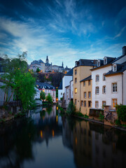 Fototapeta na wymiar Alzette river in the evening with beautiful reflections, Luxembourg city , ground. Europe, Benelux region.