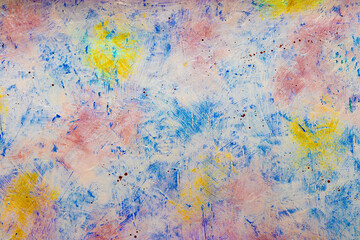 Colorful grunge concrete wall close-up. Multi-colored abstract backdrop.