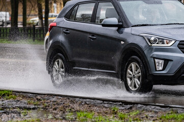 car rain puddle splashing water