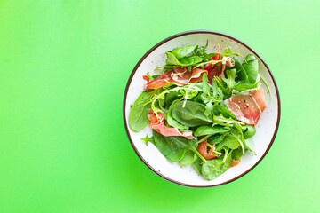 green salad jamon meat jerky dry-cured pork leg mix leaves vegetables on the table healthy food meal snack copy space food background rustic. top view