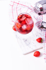 Wine glass of strawberry alcohol aperol or daiquiri cocktail.