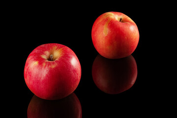 Red apples on a black background