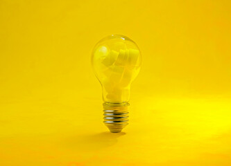 light bulb on yellow background, concept of a new idea, inspiration