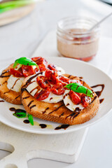 Roasted Tomato Caprese Toasts