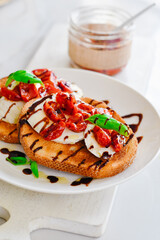 Roasted Tomato Caprese Toasts