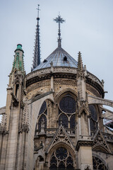 Fototapeta na wymiar Paris, France - February 3, 2017: Detail close up view of the French Gothic architecture of the Notre Dame de Paris. Exterior view