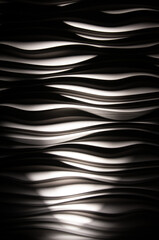 Wavy background, strong 3-D effect from dramatic shadows, soffit style lighting B&W
