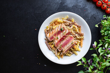 tuna pasta seafood spicy fusilli roasted fish fried grilled second course meal snack copy space...