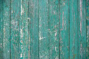 Fototapeta na wymiar Background from old boards with peeling green paint