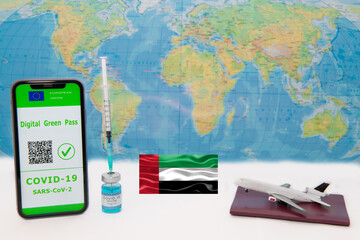 Digital green passport of the European Union with a QR code on the screen of a mobile phone with the covid-19 vaccine. The plane above the passport.
Travel without restrictions