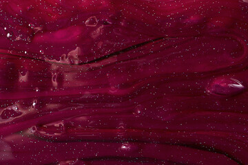 Macro photography of the slime texture.Abstrat marsala background with copy space.
