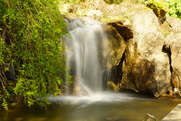 Water rushes down a waterfall.