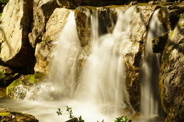 Water rushes down a waterfall.