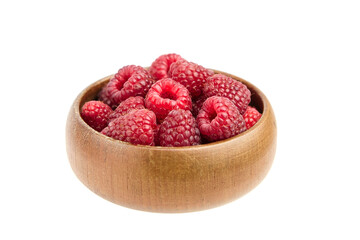 Fresh raspberries in wooden bowl isolated on white background. Red sweet raspberries