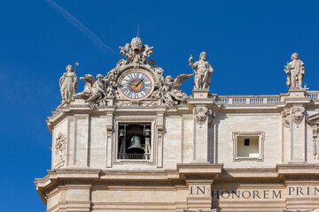Fototapeta na wymiar Facade of Saint Peter's Basilica with Bell Gate, Vatican, Rome, Italy