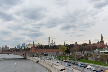 Fototapeta na wymiar Panorama of center of Moscow: view on Kremlin, Moscow City skyscrapers, Moscow river and embankment. Famous touristic view.