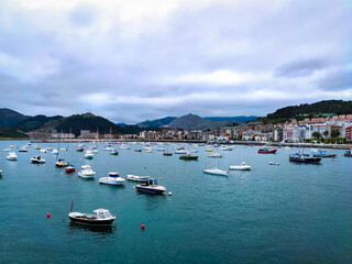 seaport with boats and mountains in the north of spain