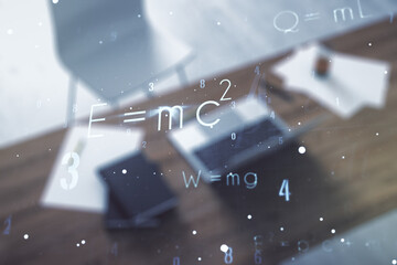 Creative scientific formula illustration and modern desktop with pc on background, science and research concept. Multiexposure