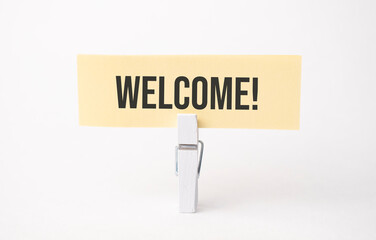 WELCOME text on paper. On white background