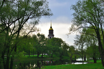 View of the church tower from the park by the river