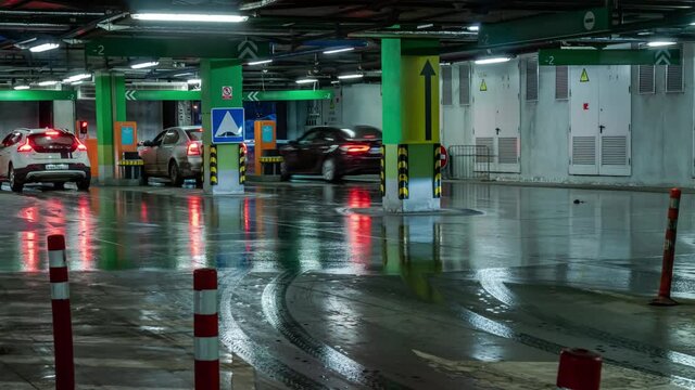Entry and exit of cars from  underground Parking lot of shopping mall, time lapse