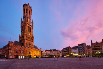 Fototapeta premium Belfry tower and Grote markt square in Bruges, Belgium on dusk in twilight