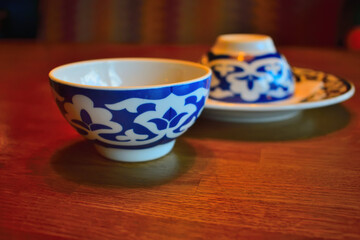 Two oriental white blue tea cups