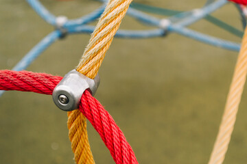 Colorful ropes on the sports ground. Connections of rope ropes for training.