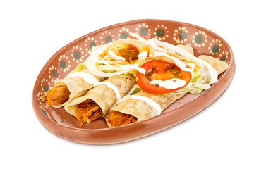 Delicious Mexican snacks in traditional clay plate