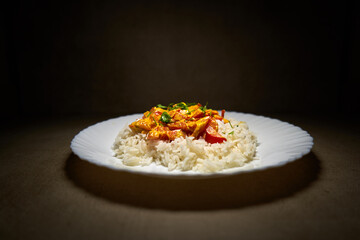 Rice with baked vegetables mixed with coconut sauce