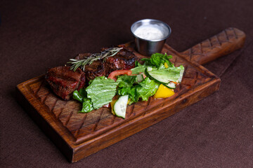 duck fillet baked on a wooden board