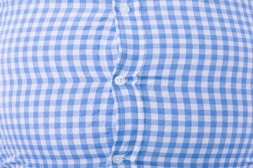 Close up of a tight shirt of a man with overweight, typical photo for beer belly: Selective focus. 