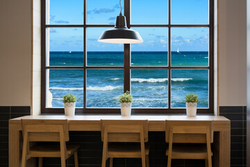 View of Mediterranean Sea through a cafe window