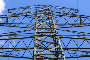 High voltage electric tower with blue sky background