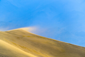 Blowing sand on sand dune