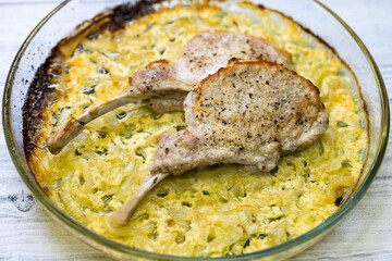 seared pork chop roasted on creamy onion