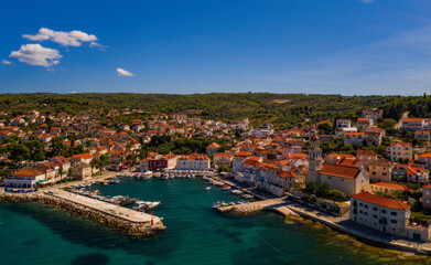 Fototapeta na wymiar Town of Sutivan skyline view, Island of Brac, Croatia. Aerial drone view in august 2020